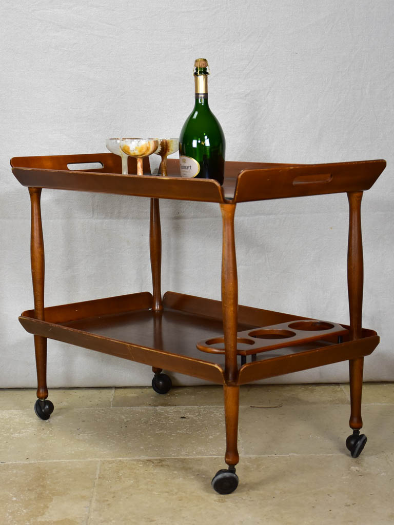 Dark-toned antique wooden bar cart