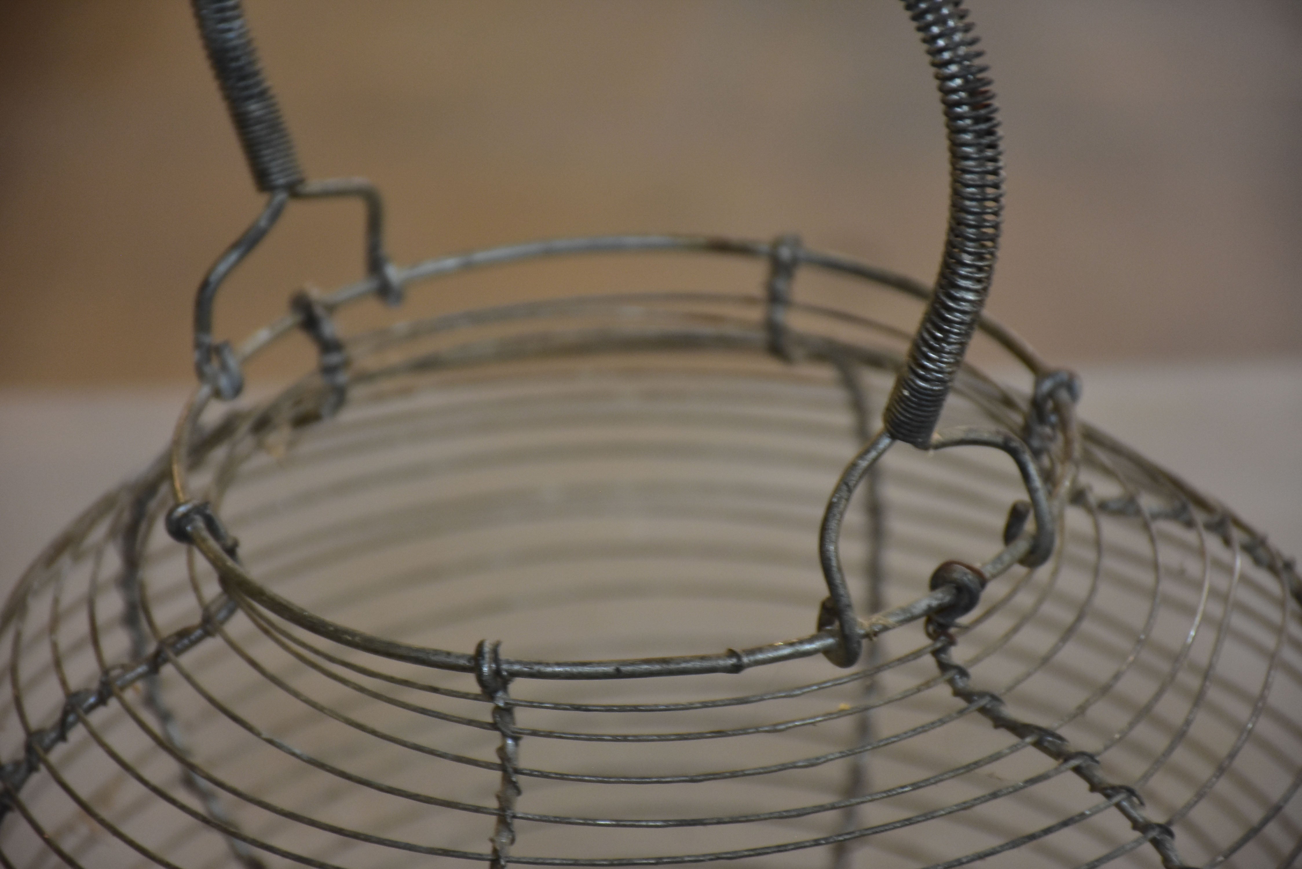 Two antique French wire baskets