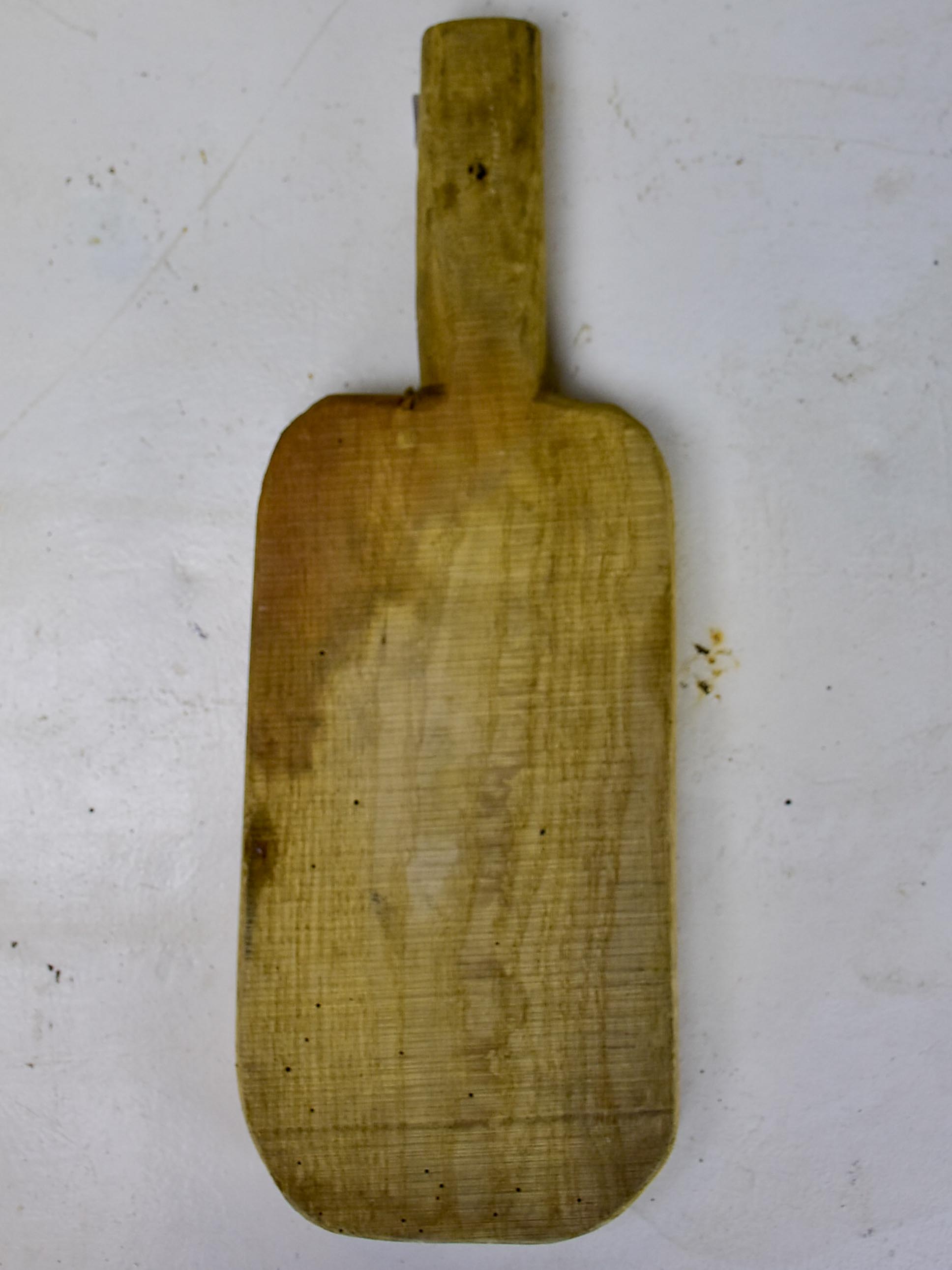 Antique French cutting board with long handle 11”