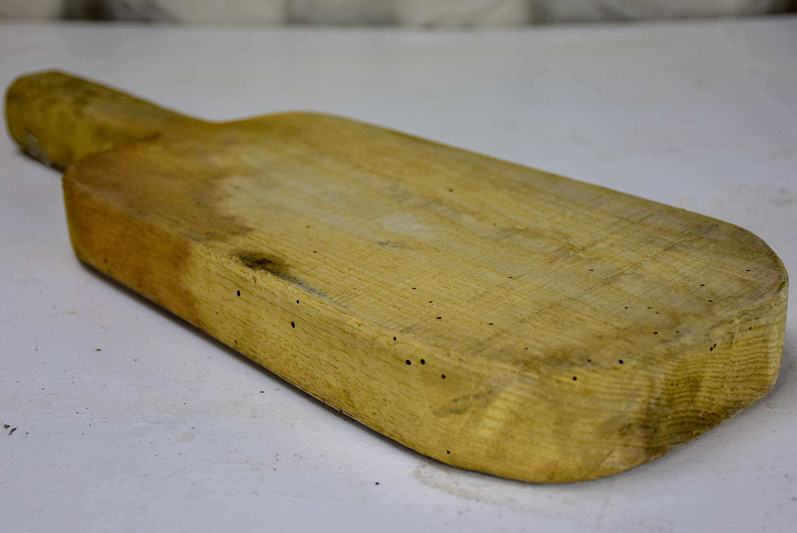 Antique French cutting board with long handle 11”