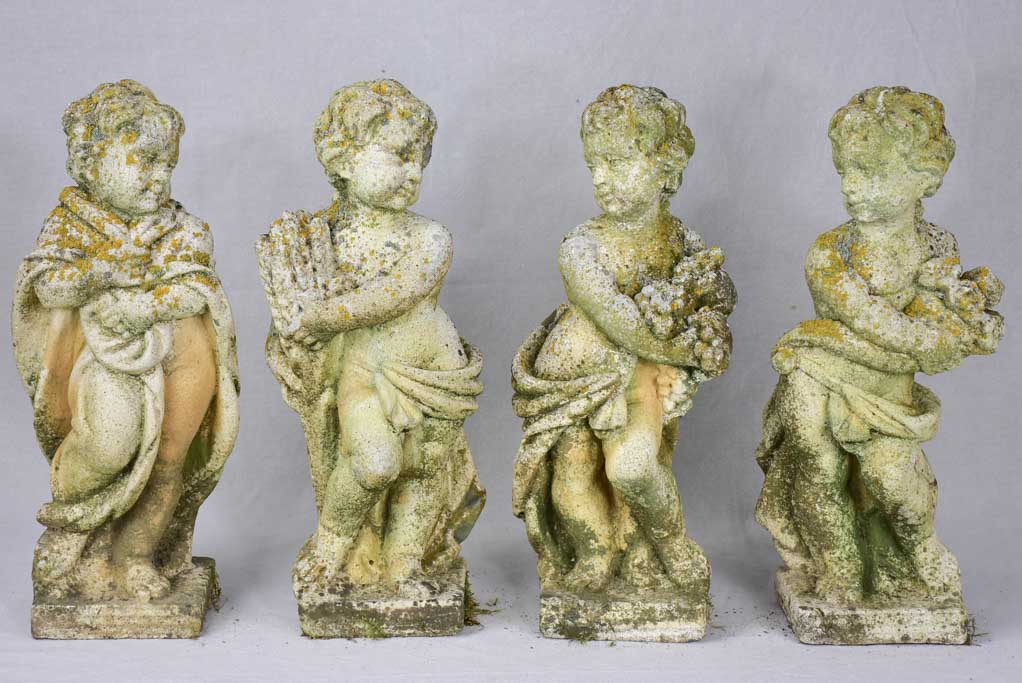 Collection of four vintage cherubs representing the four seasons - weathered patina 19¼"