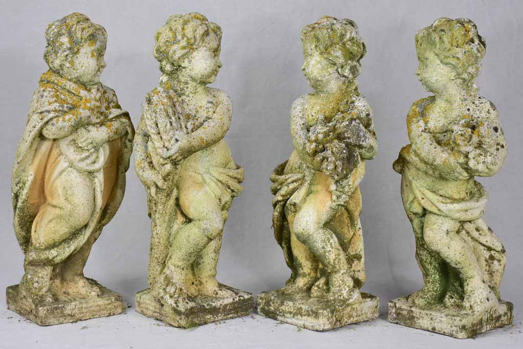 Collection of four vintage cherubs representing the four seasons - weathered patina 19¼"