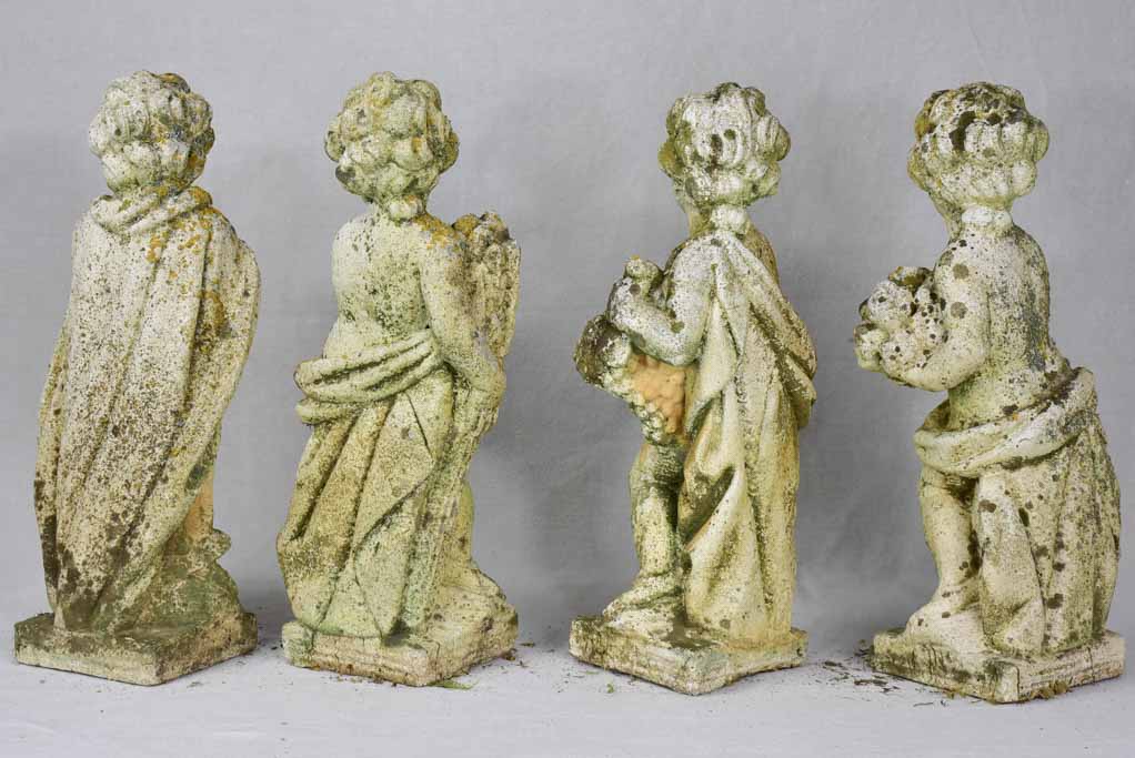 Collection of four vintage cherubs representing the four seasons - weathered patina 19¼"