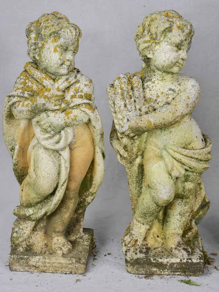 Collection of four vintage cherubs representing the four seasons - weathered patina 19¼"