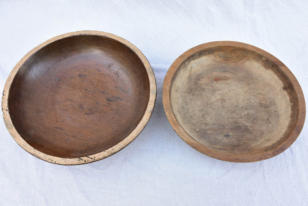 Two primitive wooden cream bowls with three spoons from Angers