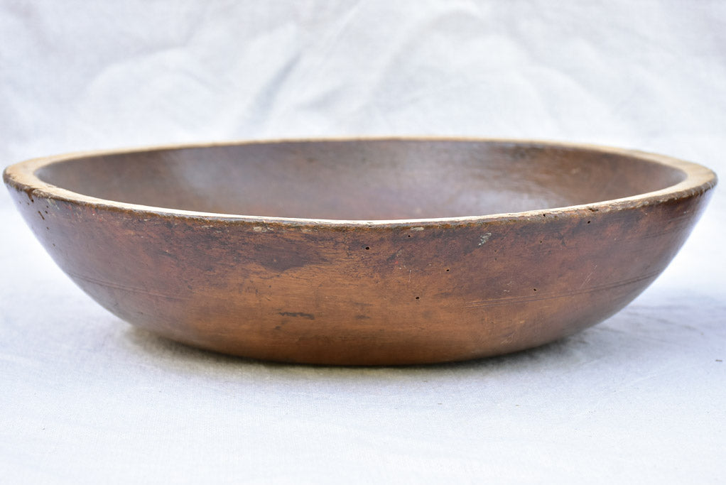 Two primitive wooden cream bowls with three spoons from Angers