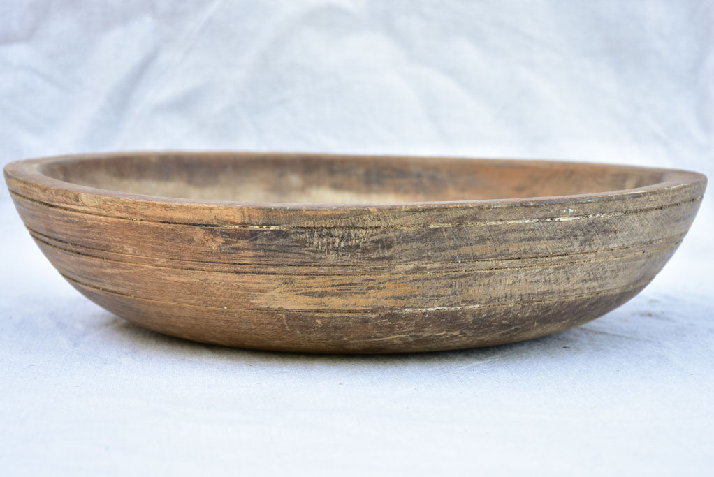 Two primitive wooden cream bowls with three spoons from Angers