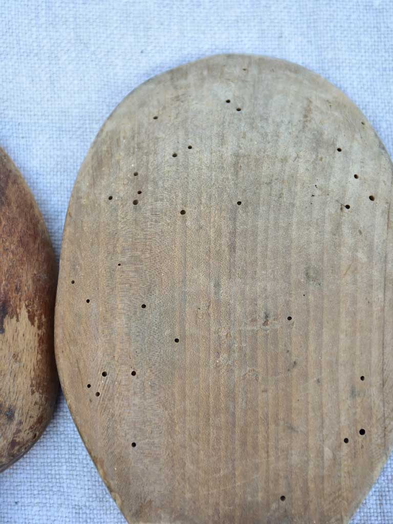 Two primitive wooden cream bowls with three spoons from Angers