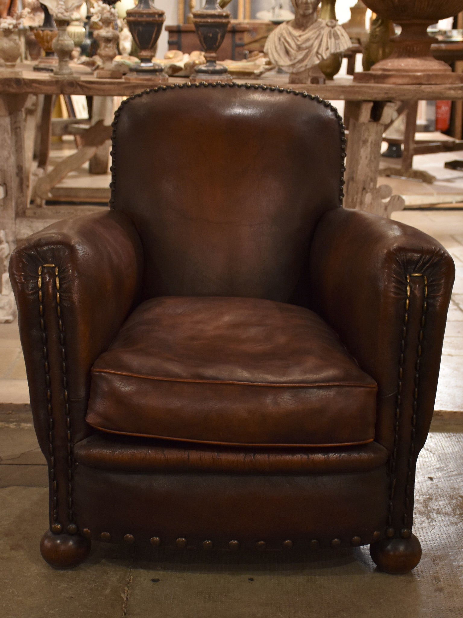 Dark French leather studded club chair - clouté