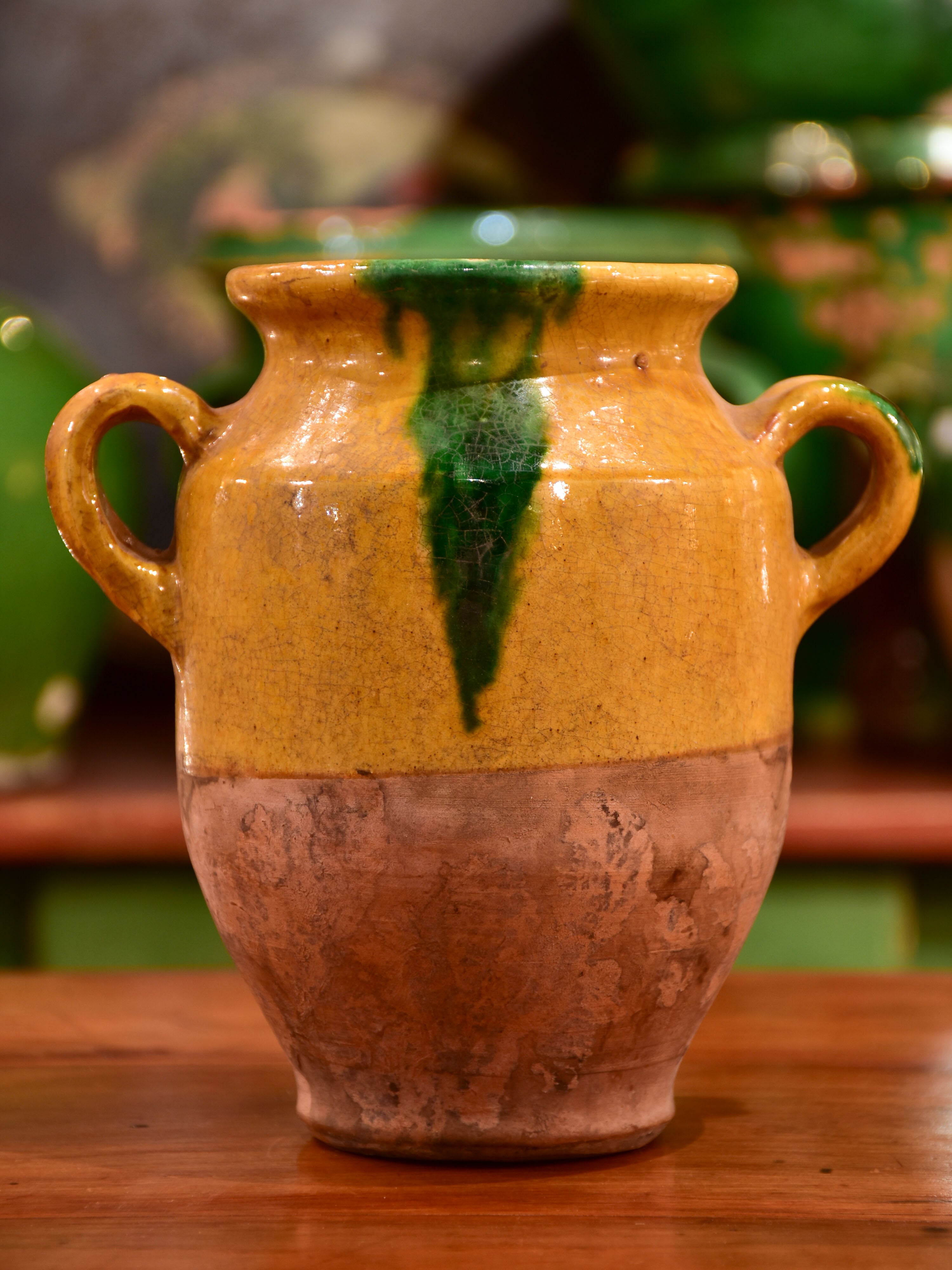 Small antique French confit pot with orange and green glaze