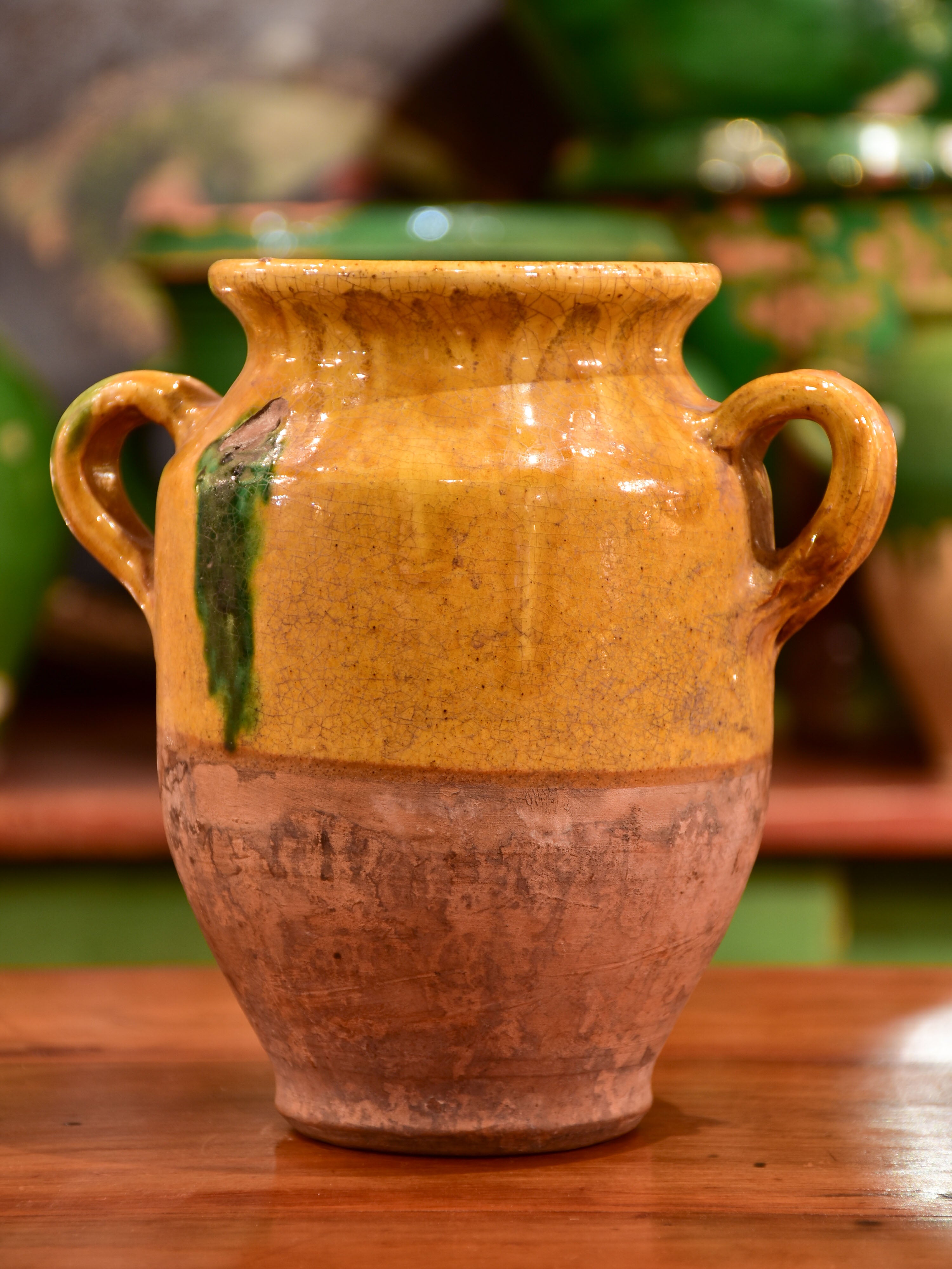 Small antique French confit pot with orange and green glaze