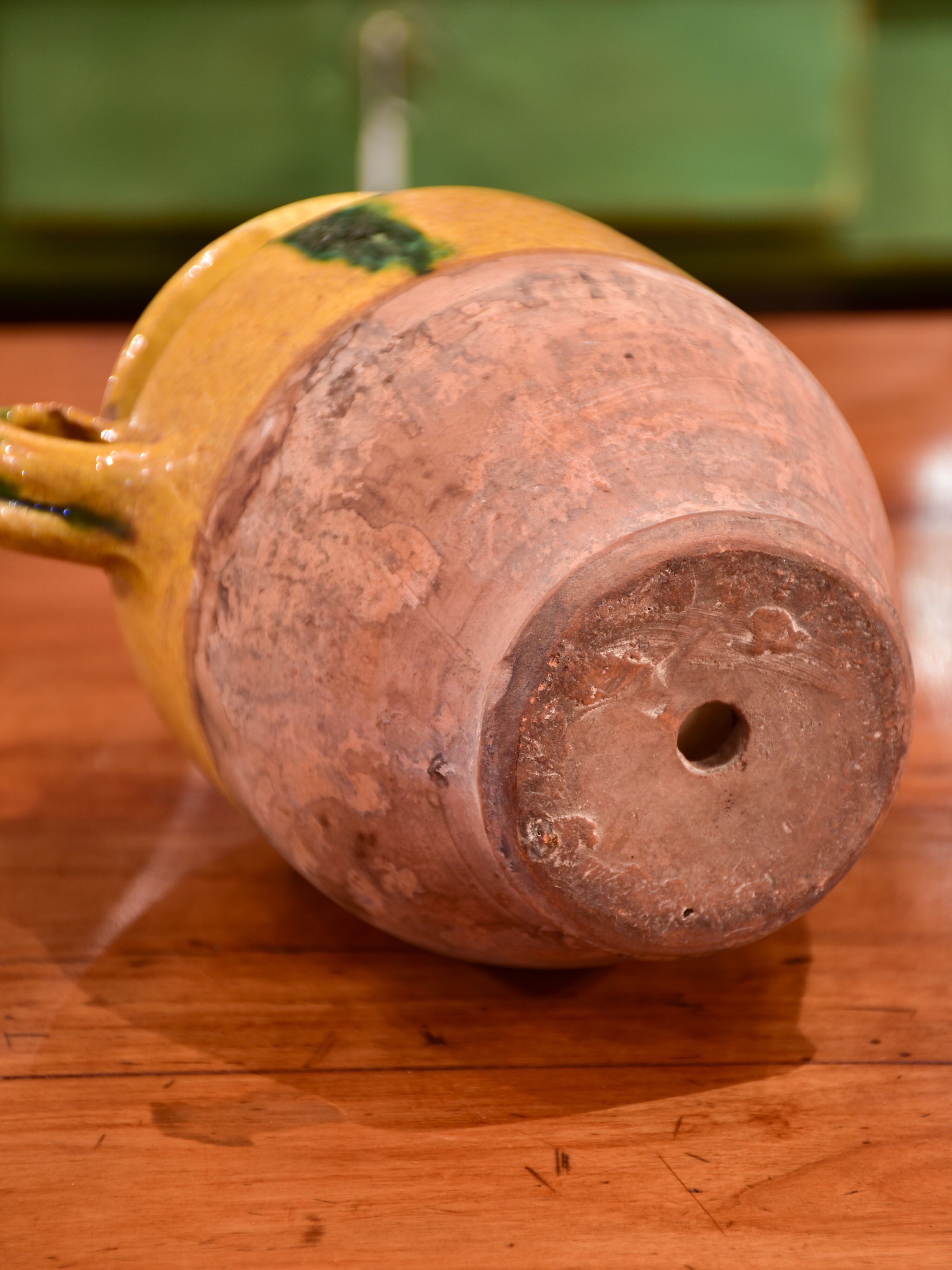 Small antique French confit pot with orange and green glaze