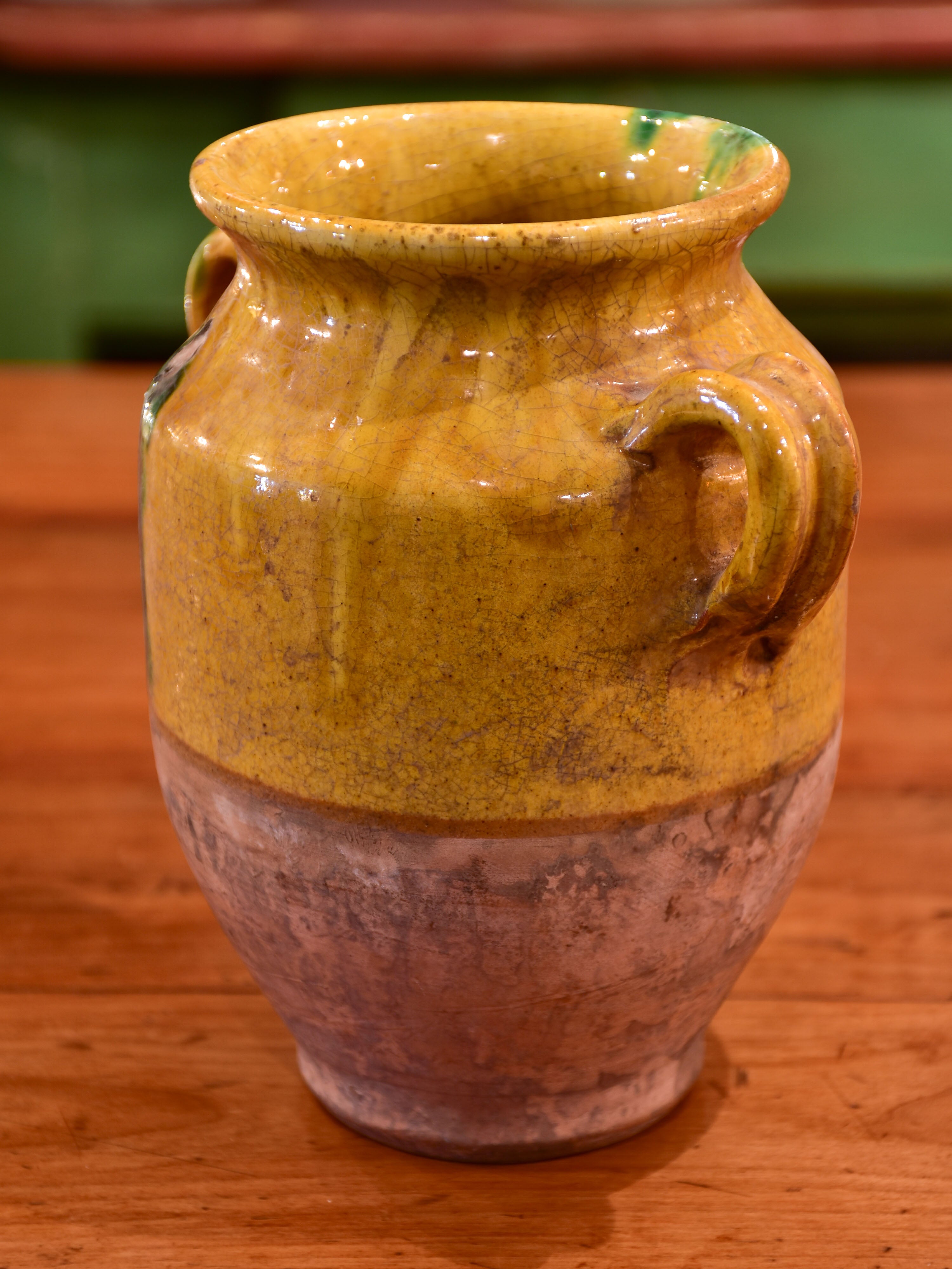 Small antique French confit pot with orange and green glaze