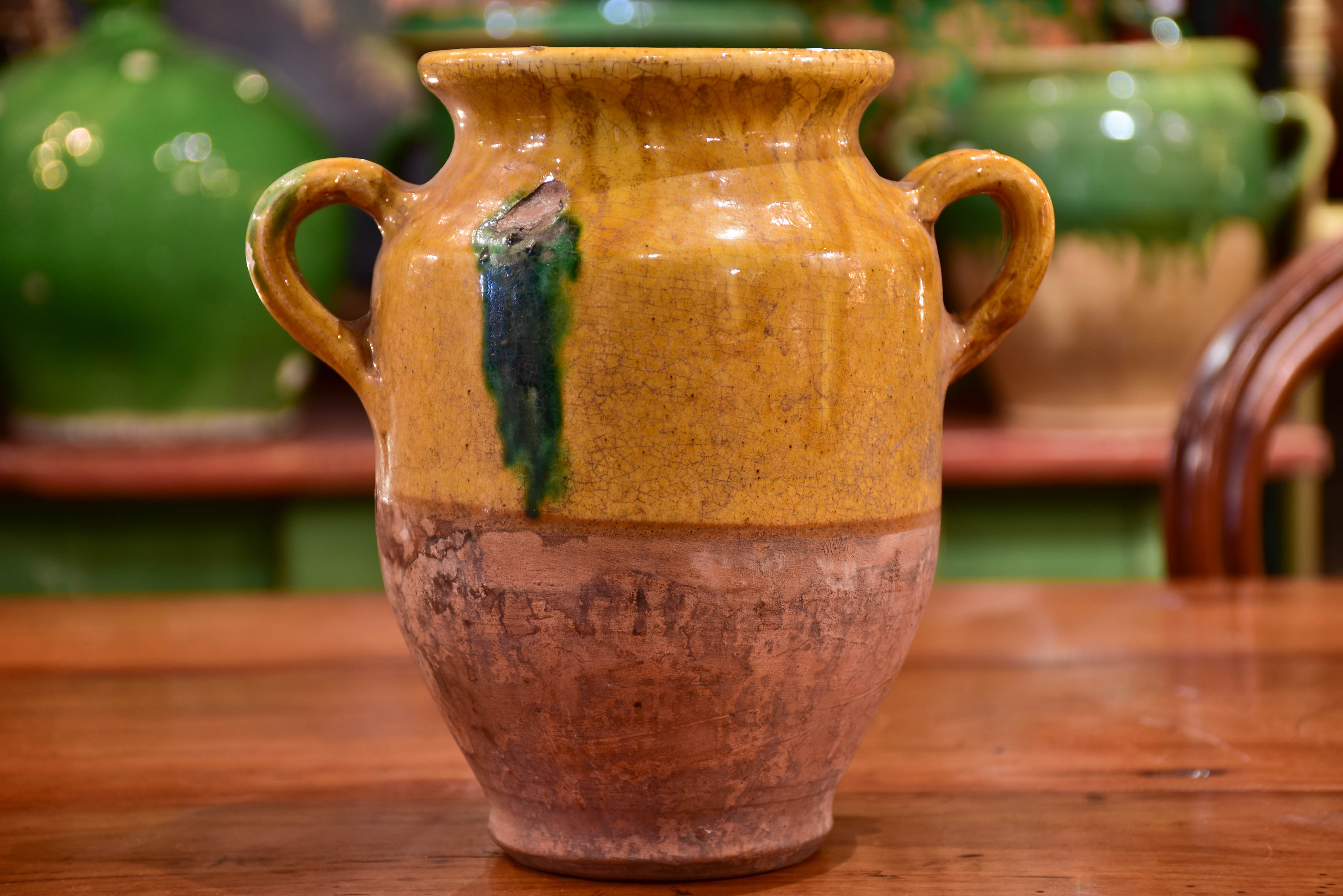 Small antique French confit pot with orange and green glaze