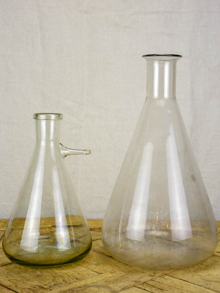 Two large vintage glass flasks from a laboratory