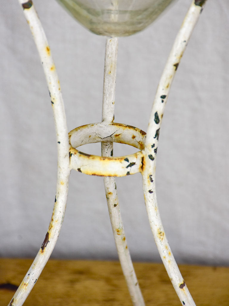 Group of three vintage flasks mounted on iron tripod stands