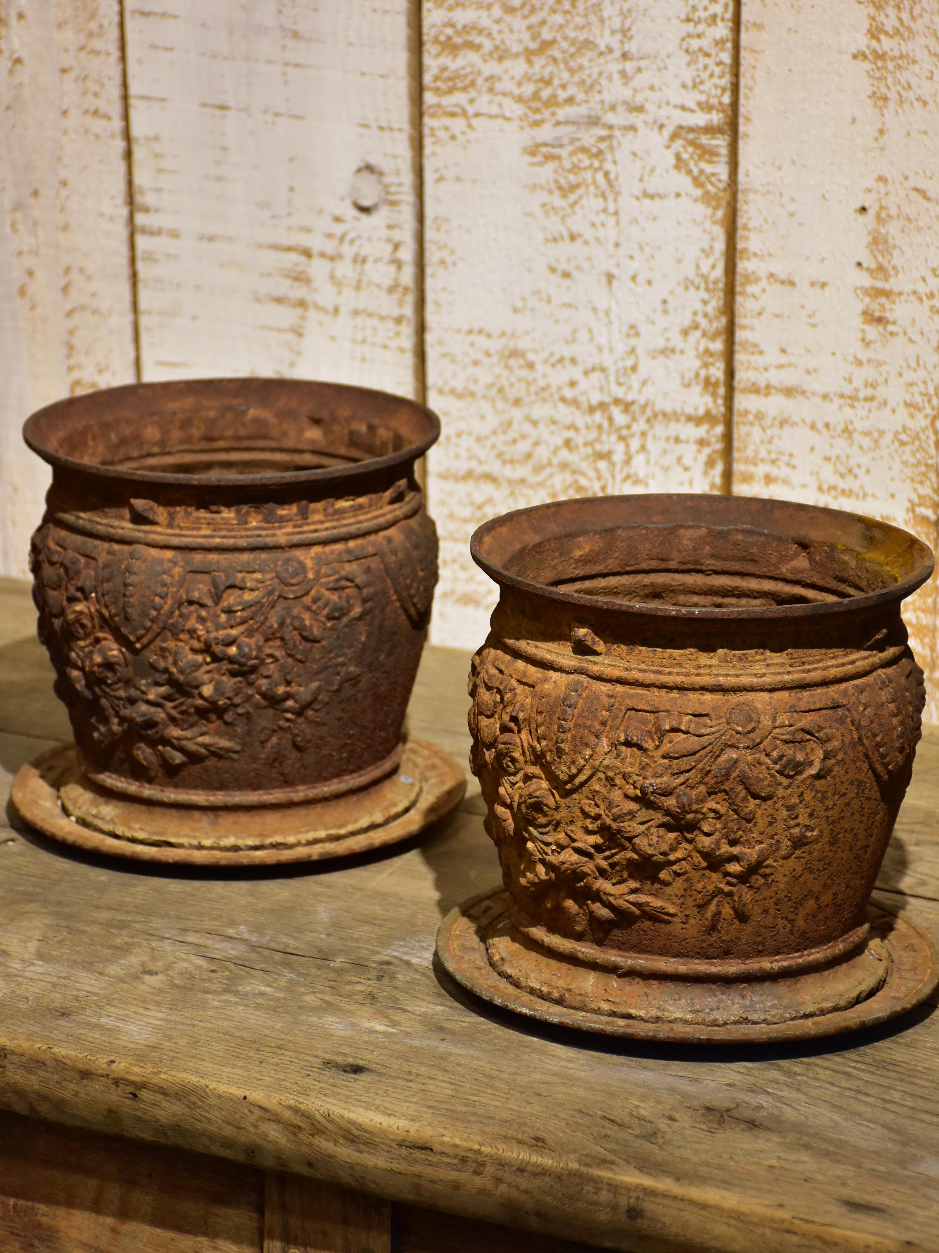 Pair of antique French cast iron planters / pot stands