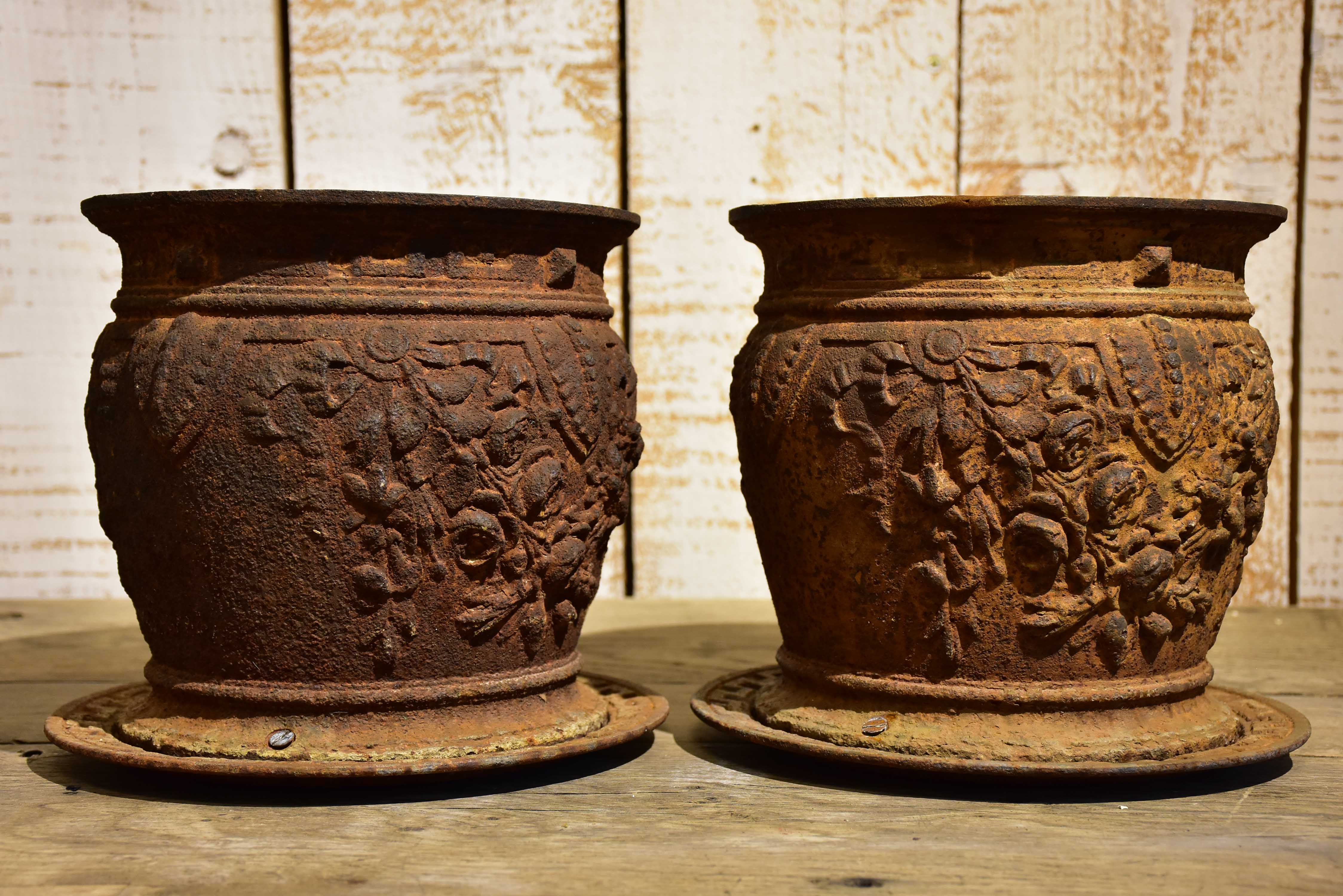 Pair of antique French cast iron planters / pot stands