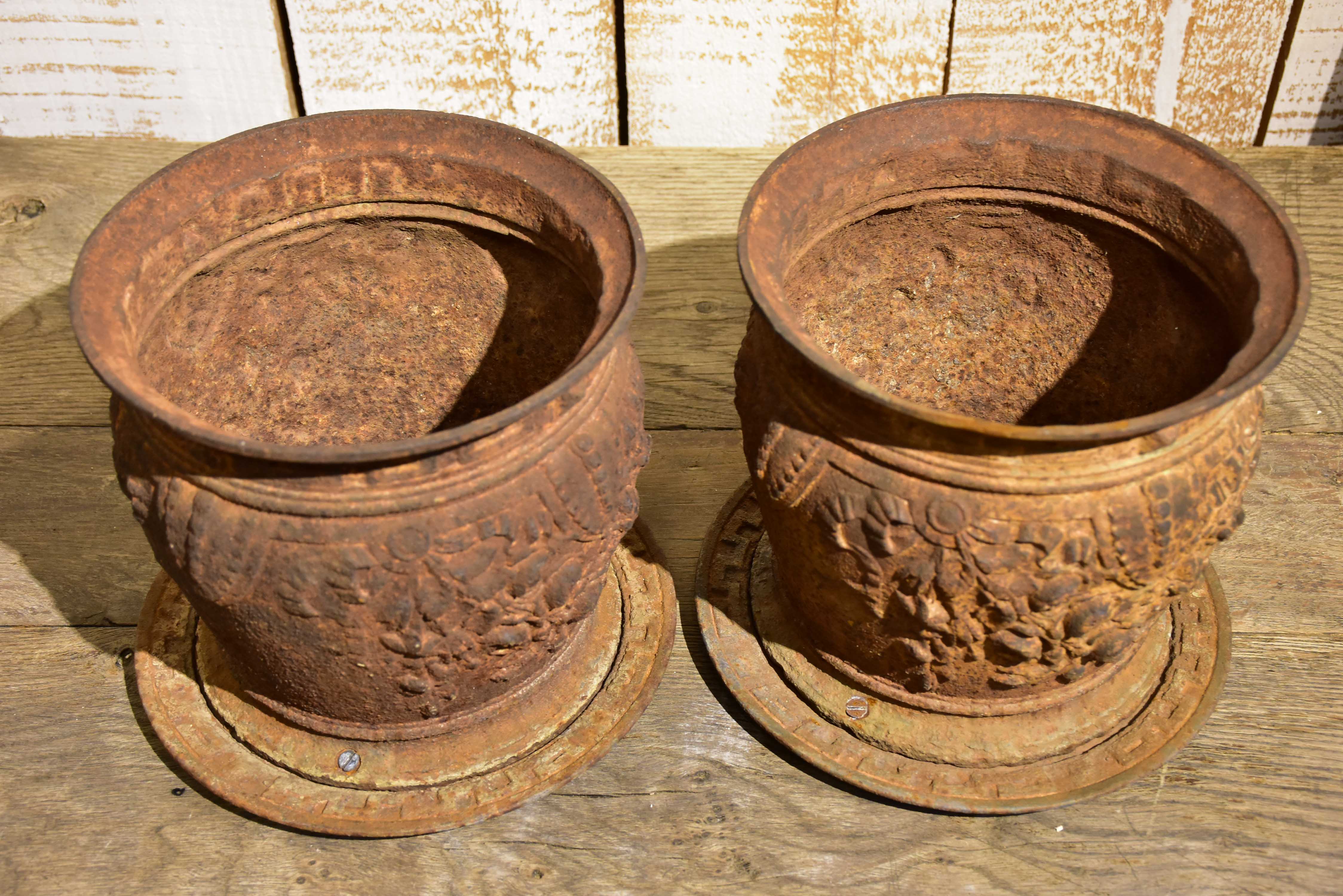 Pair of antique French cast iron planters / pot stands