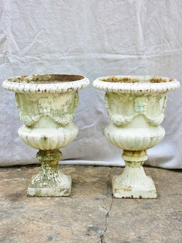 Pair of 19th Century cast iron Medici urns with white paint finish 17¼"