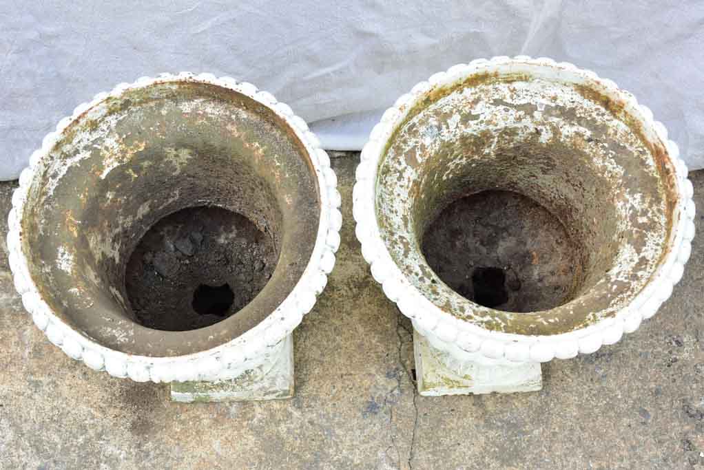 Pair of 19th Century cast iron Medici urns with white paint finish 17¼"