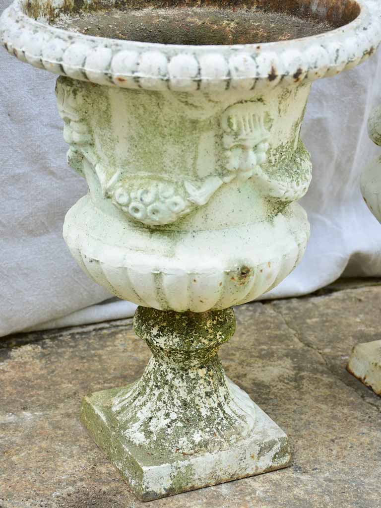 Pair of 19th Century cast iron Medici urns with white paint finish 17¼"