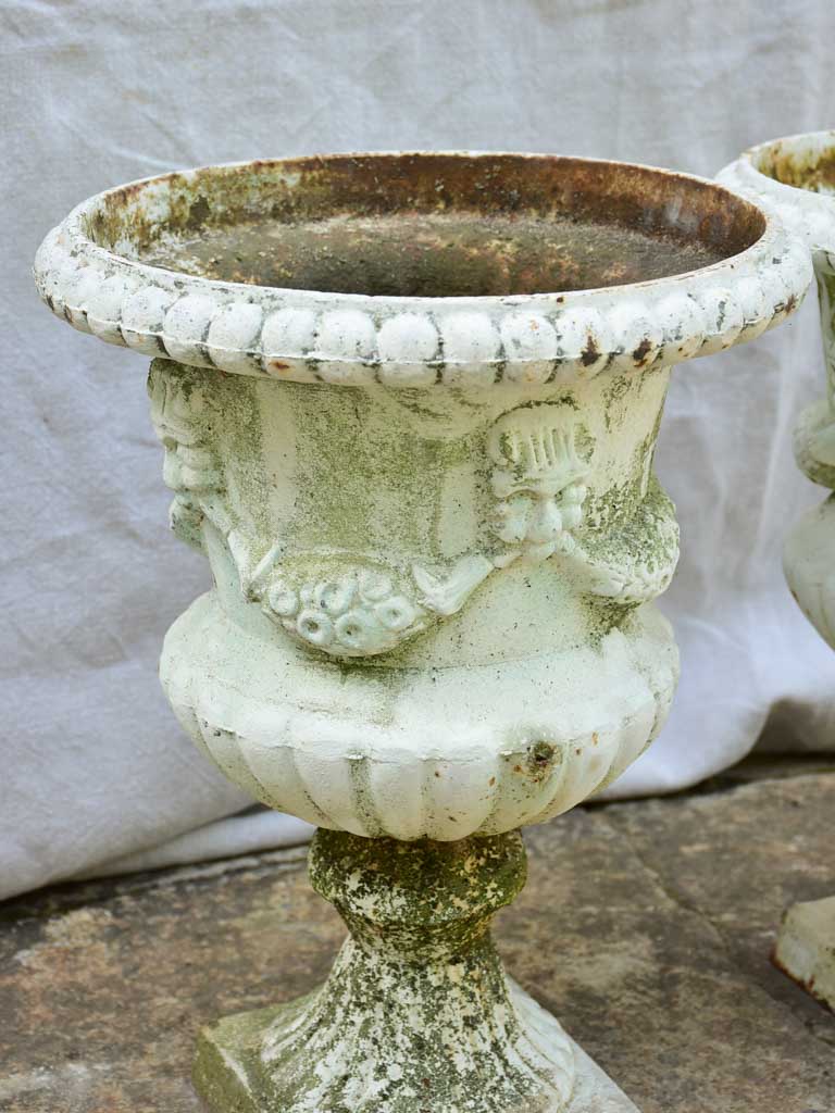 Pair of 19th Century cast iron Medici urns with white paint finish 17¼"