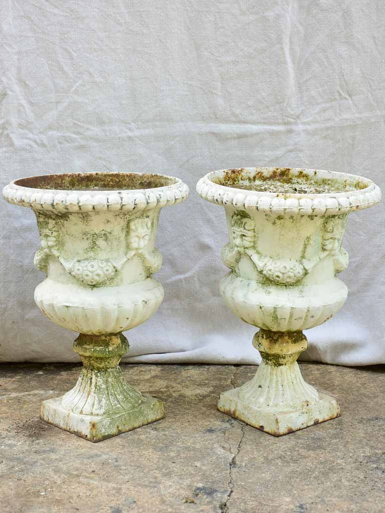 Pair of 19th Century cast iron Medici urns with white paint finish 17¼"