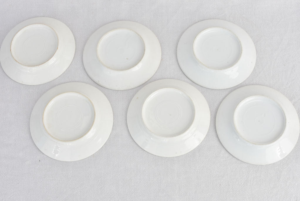 20th-century antiqued white ceramic plate set