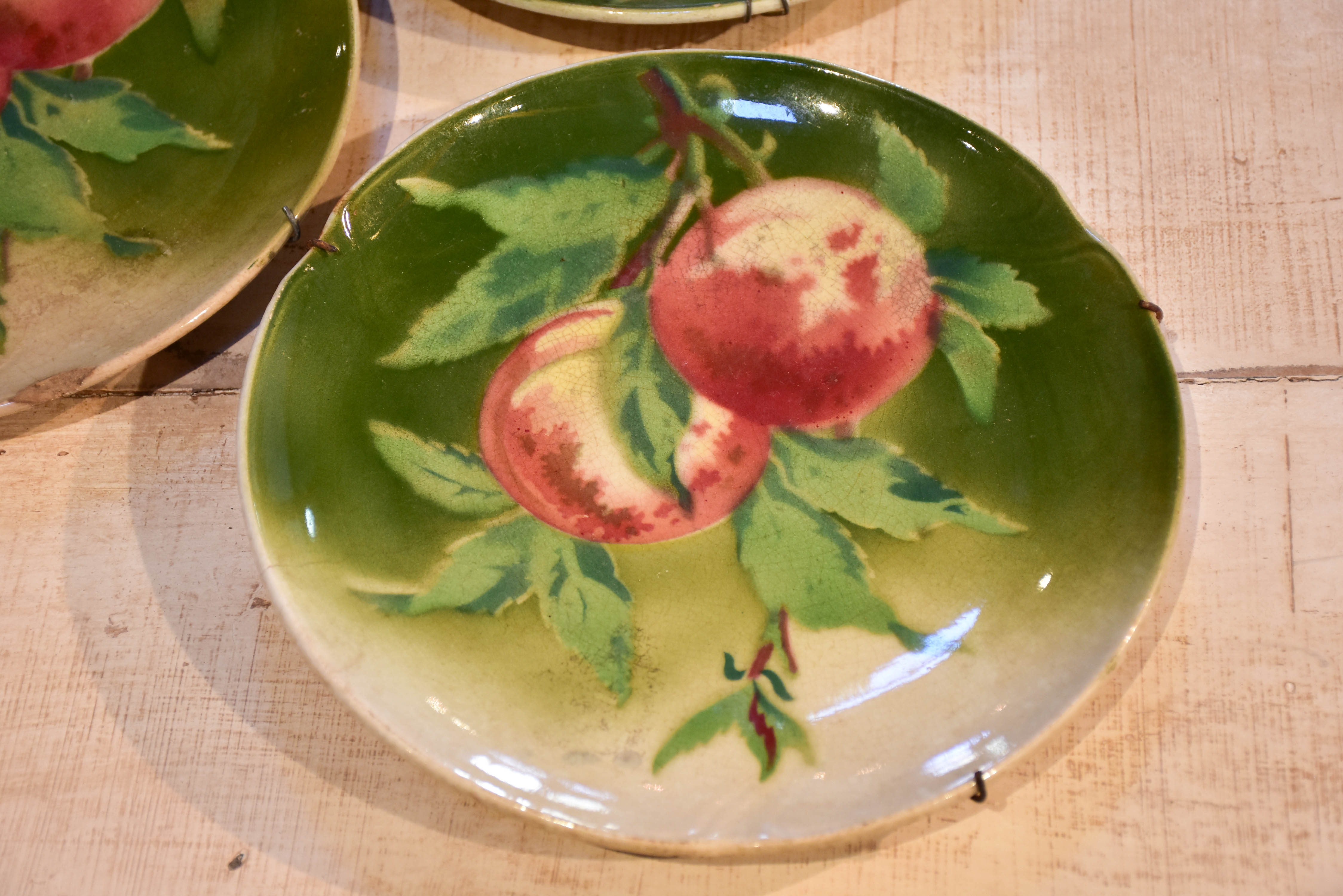 Three antique Gien plates with fruit