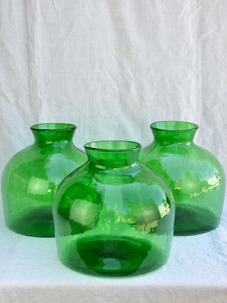 Three very large green glass vases / bottles 13½"