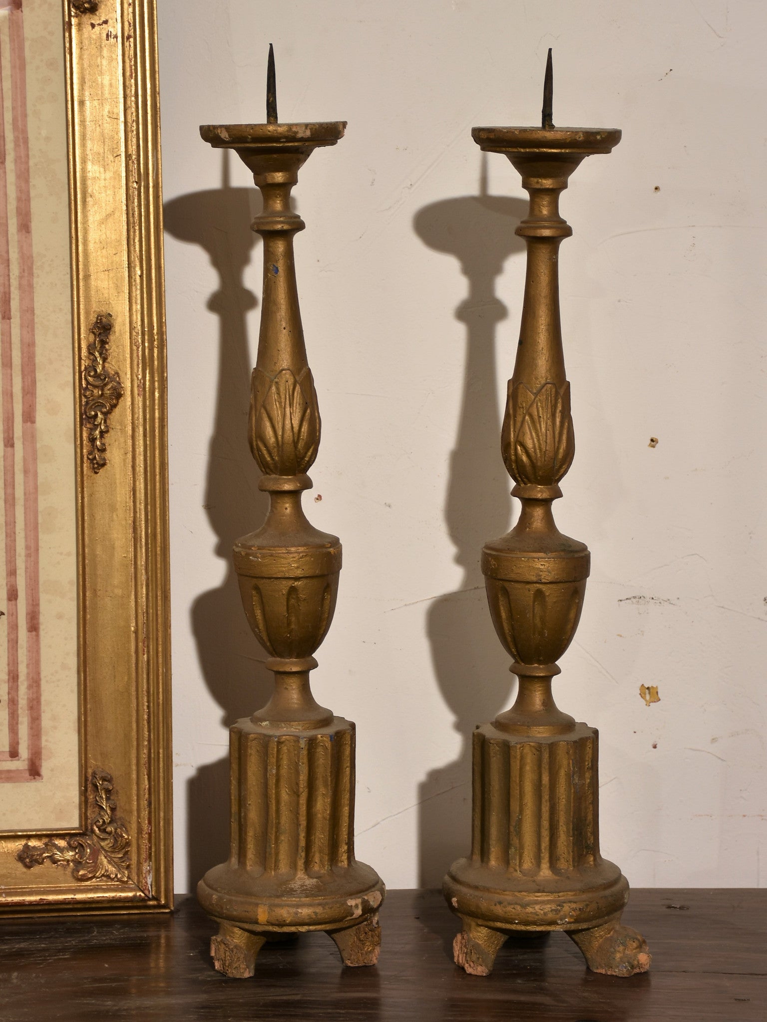 Pair of carved antique Italian candlesticks