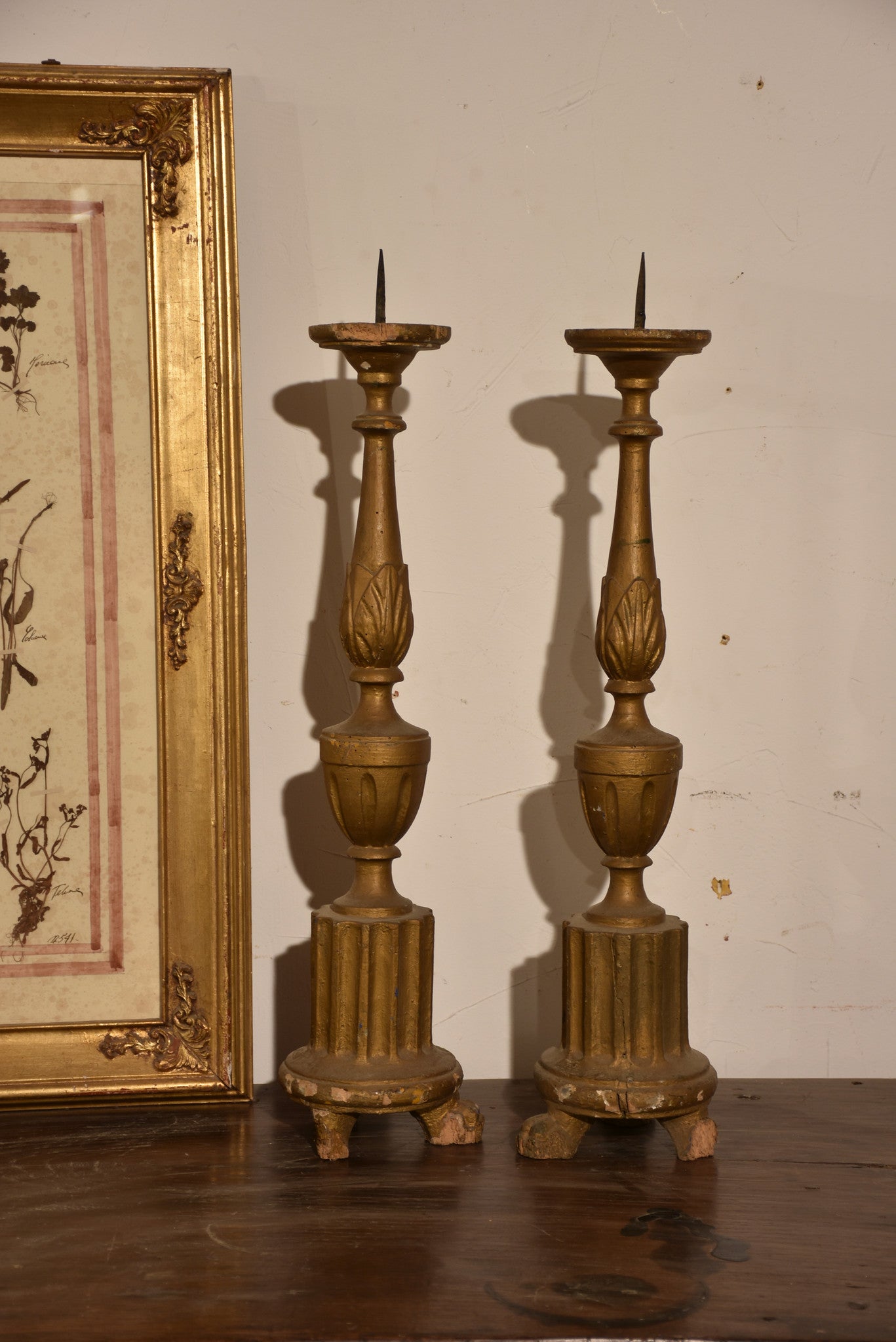 Pair of carved antique Italian candlesticks