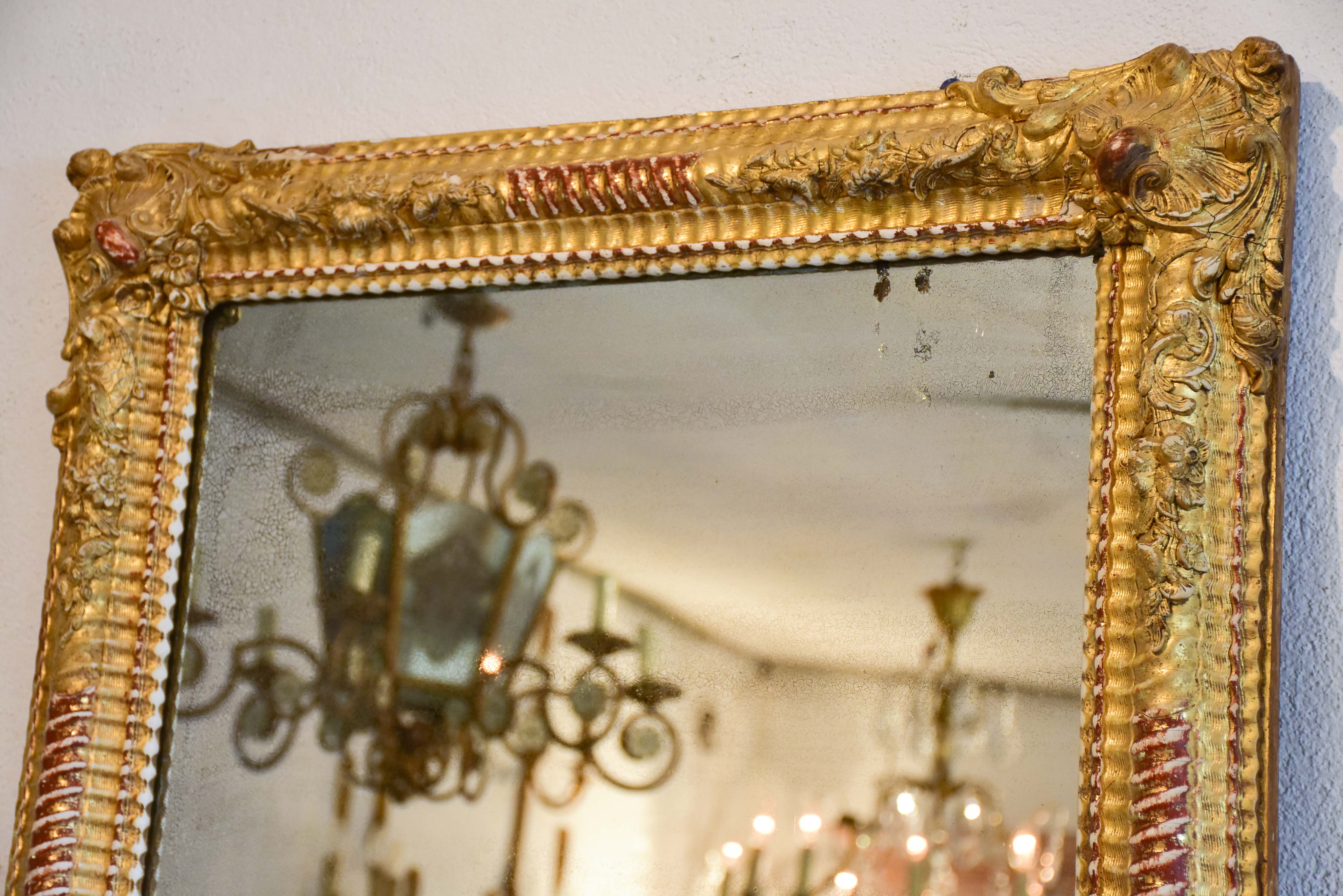 Gilded Napoleon III mirror with sculptural frame