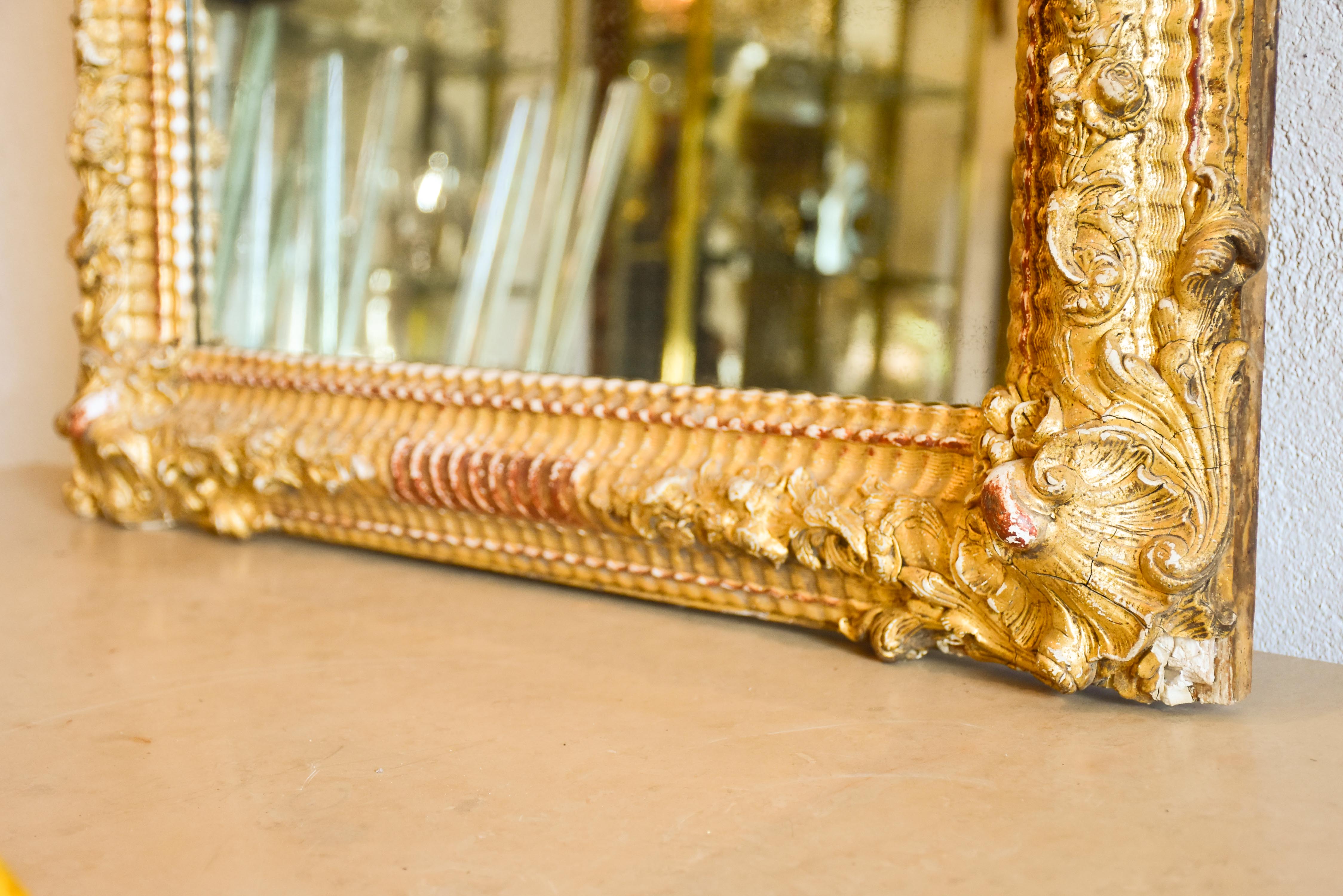 Gilded Napoleon III mirror with sculptural frame