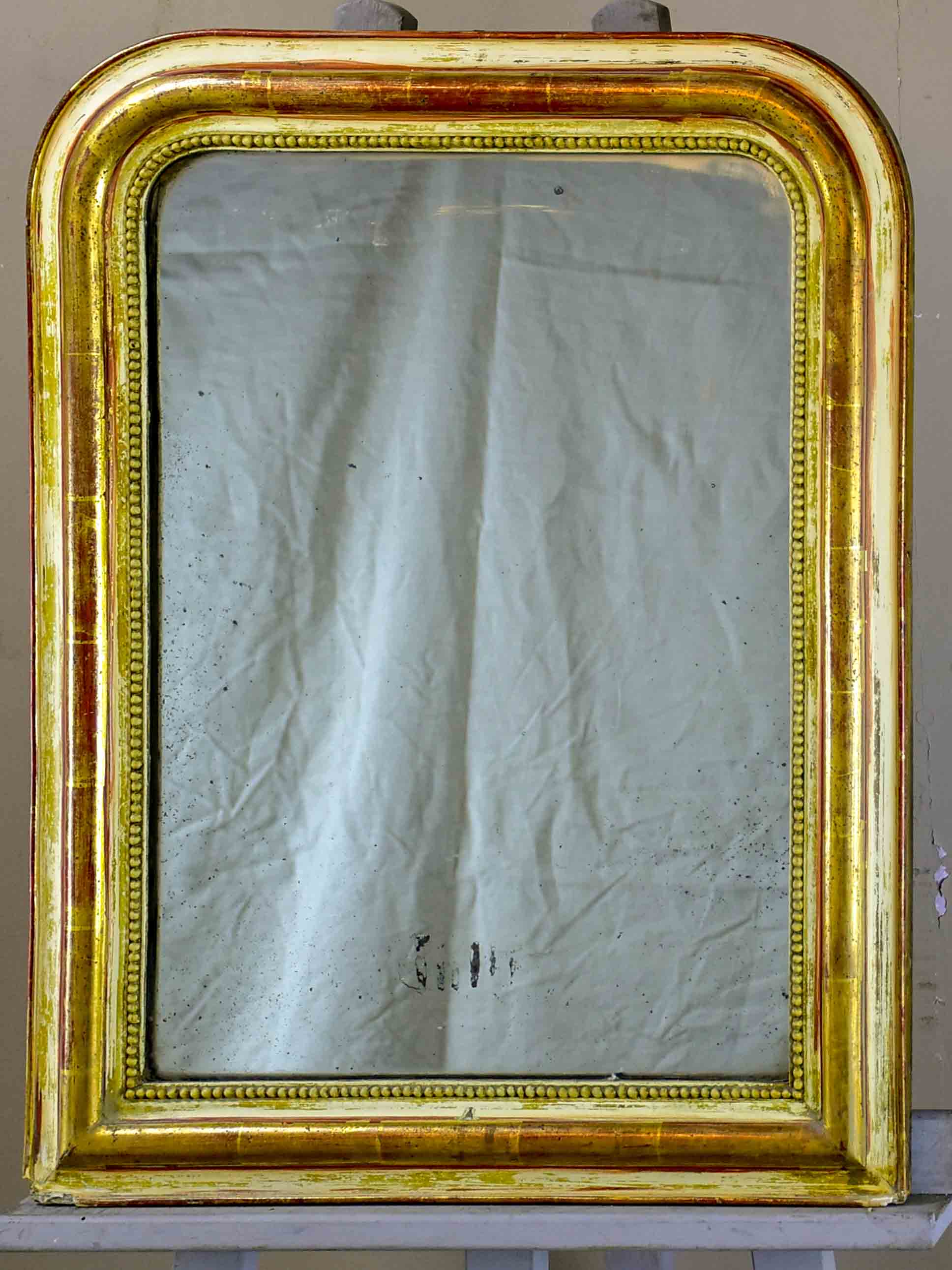 Rustic antique French Louis Philippe mirror with timeworn gilded frame