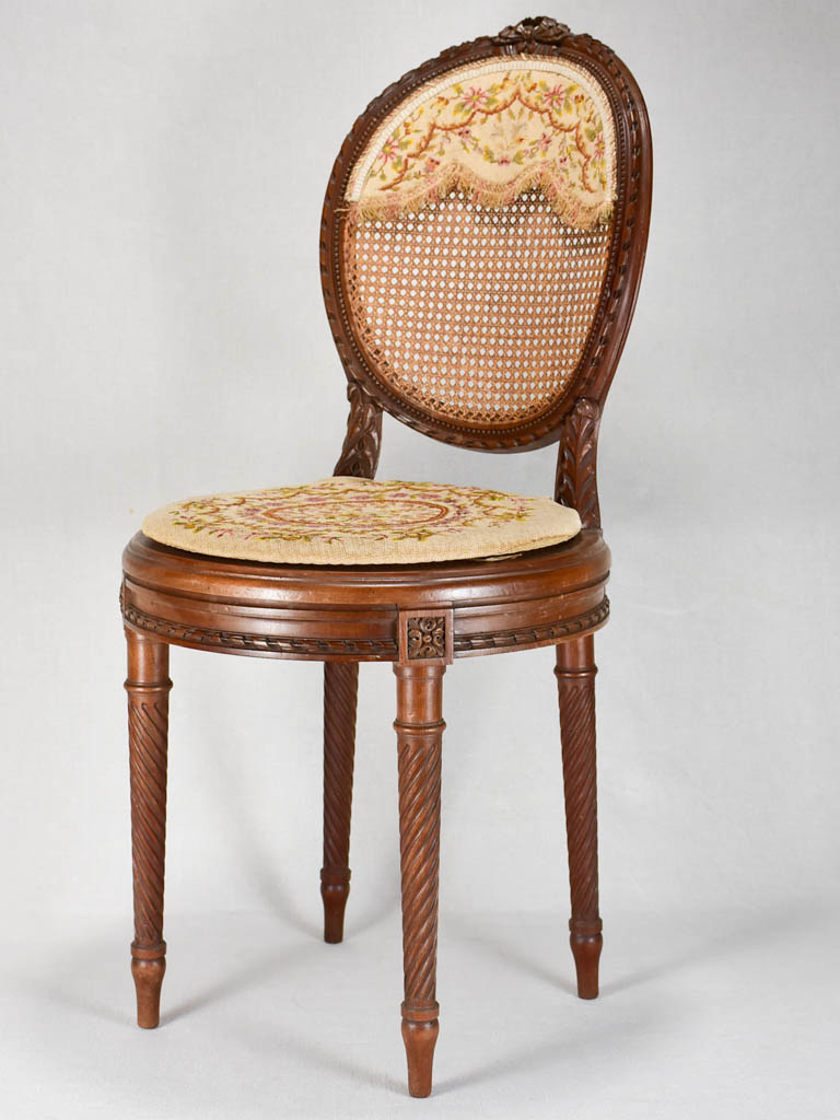 Louis XVI-style armchairs with cross-stitch upholstery