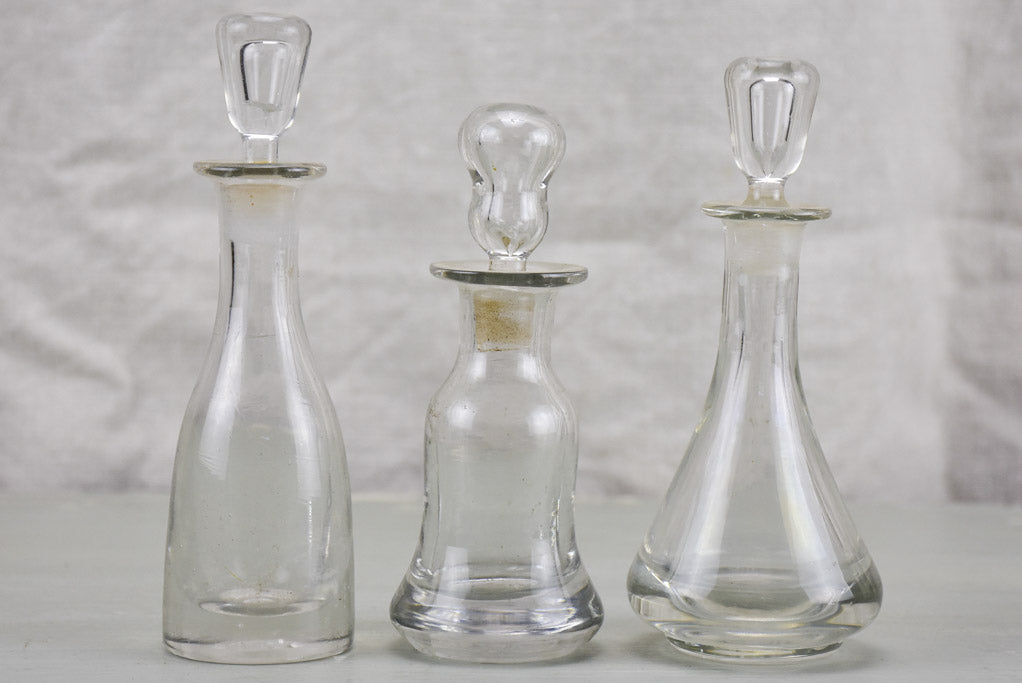 Three antique French absinthe bottles with stoppers