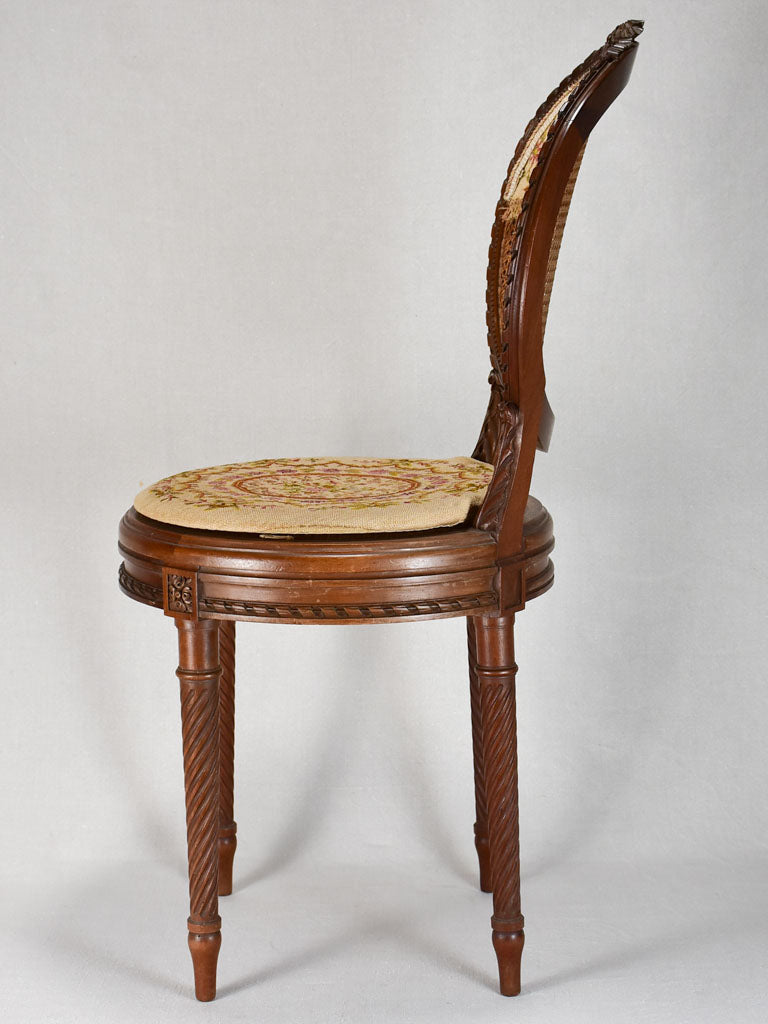 Louis XVI-style armchairs with cross-stitch upholstery