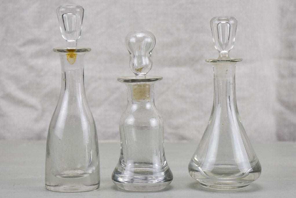 Three antique French absinthe bottles with stoppers