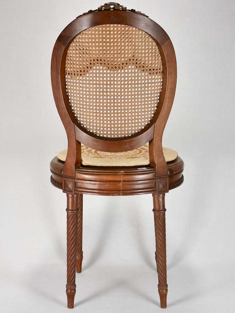 Louis XVI-style armchairs with cross-stitch upholstery