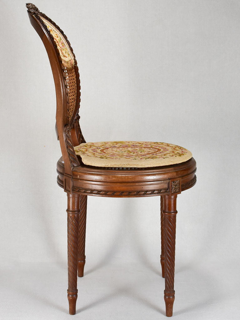 Louis XVI-style armchairs with cross-stitch upholstery