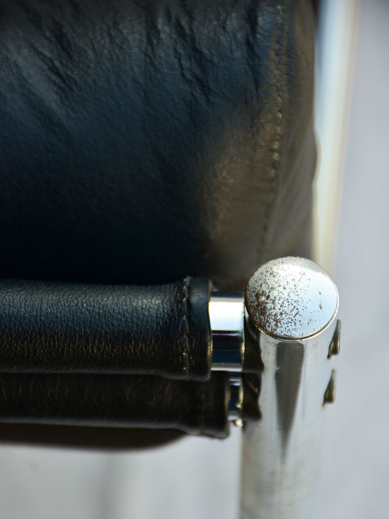 Pair of 1950's black leather and chrome armchairs in the style of Le Corbusier Charlotte Perriand