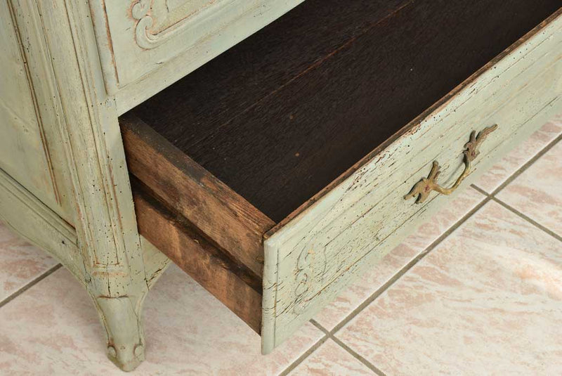 Antiqued wooden commode with blue patina