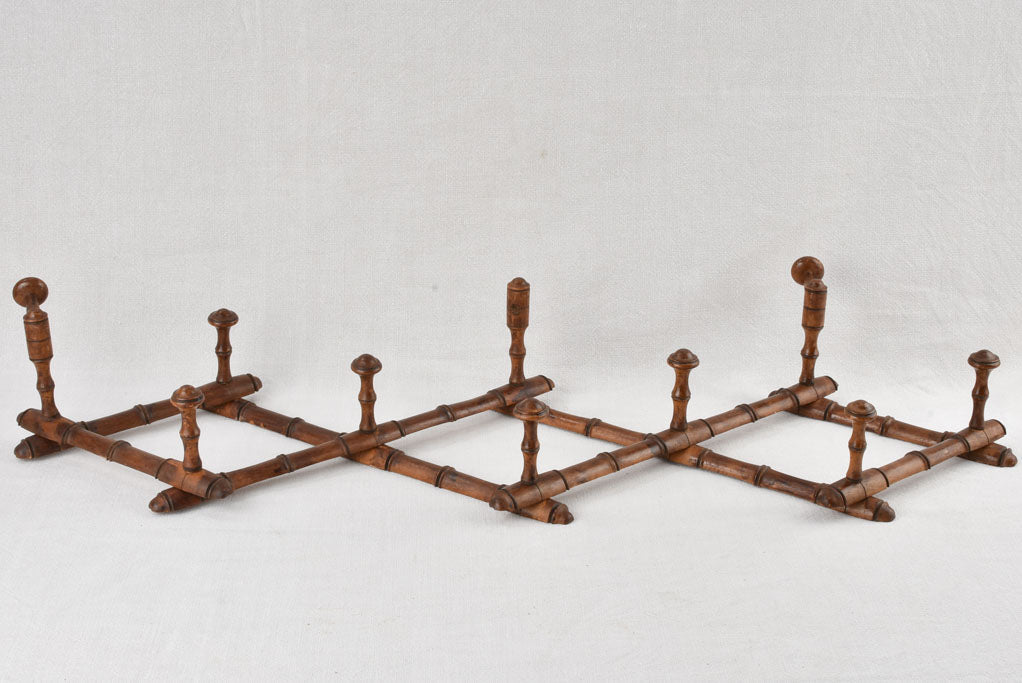 Antique concertina coat hooks 35½"