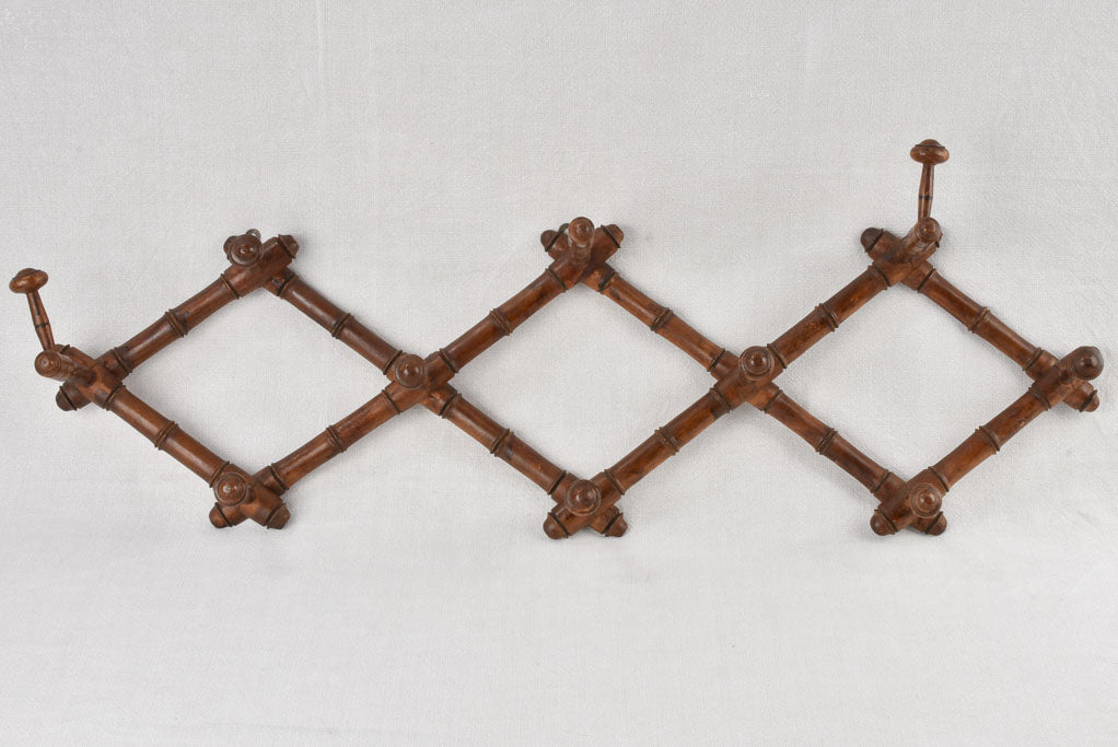 Antique concertina coat hooks 35½"