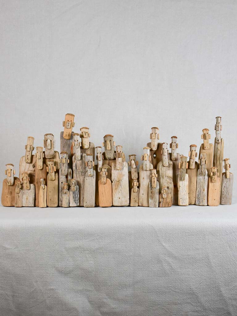 Panoramic driftwood sculpture by JP Dreano - 34 characters 27½"