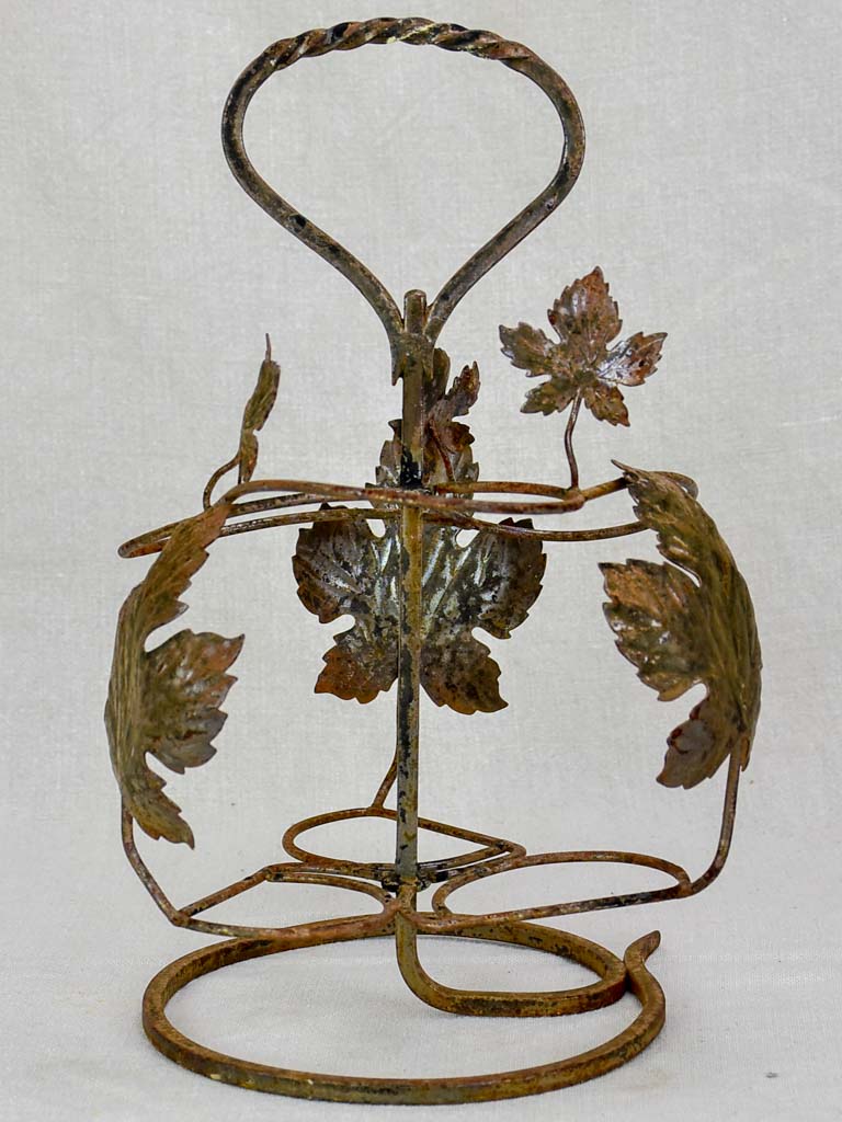 Antique metal wine bottle holder