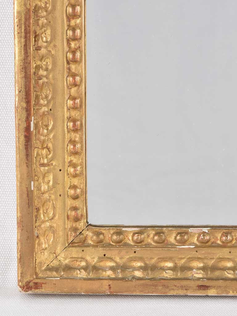 Striking Gilded Beading Louis XVI Mirror