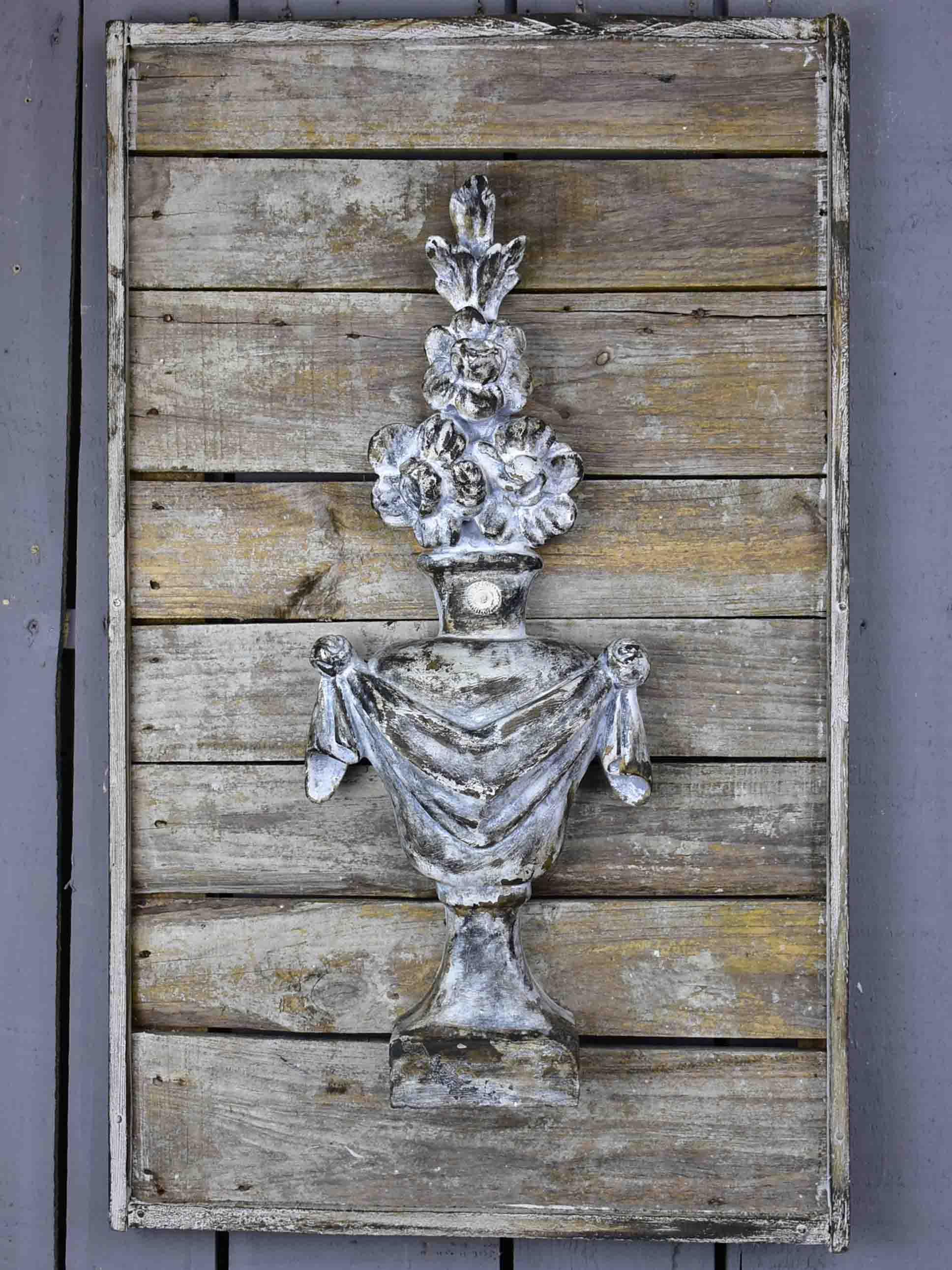 Pair of rustic French wall panels with flower urns